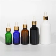 Svarta droppflaskor av glas